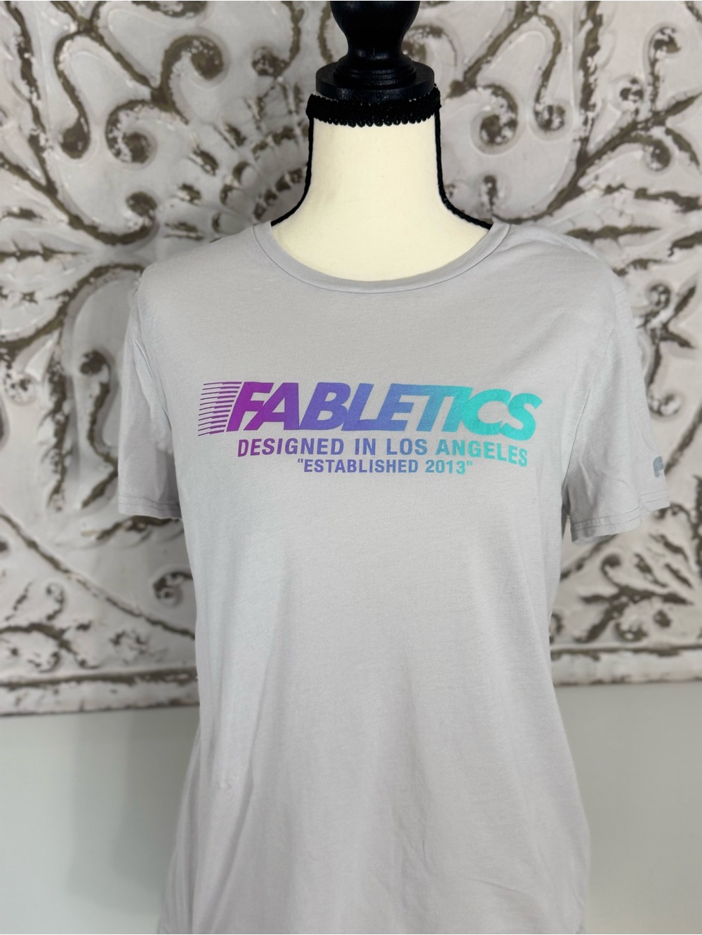 Fabletics Light Gray Tee with Purple-to-Teal Gradient Logo